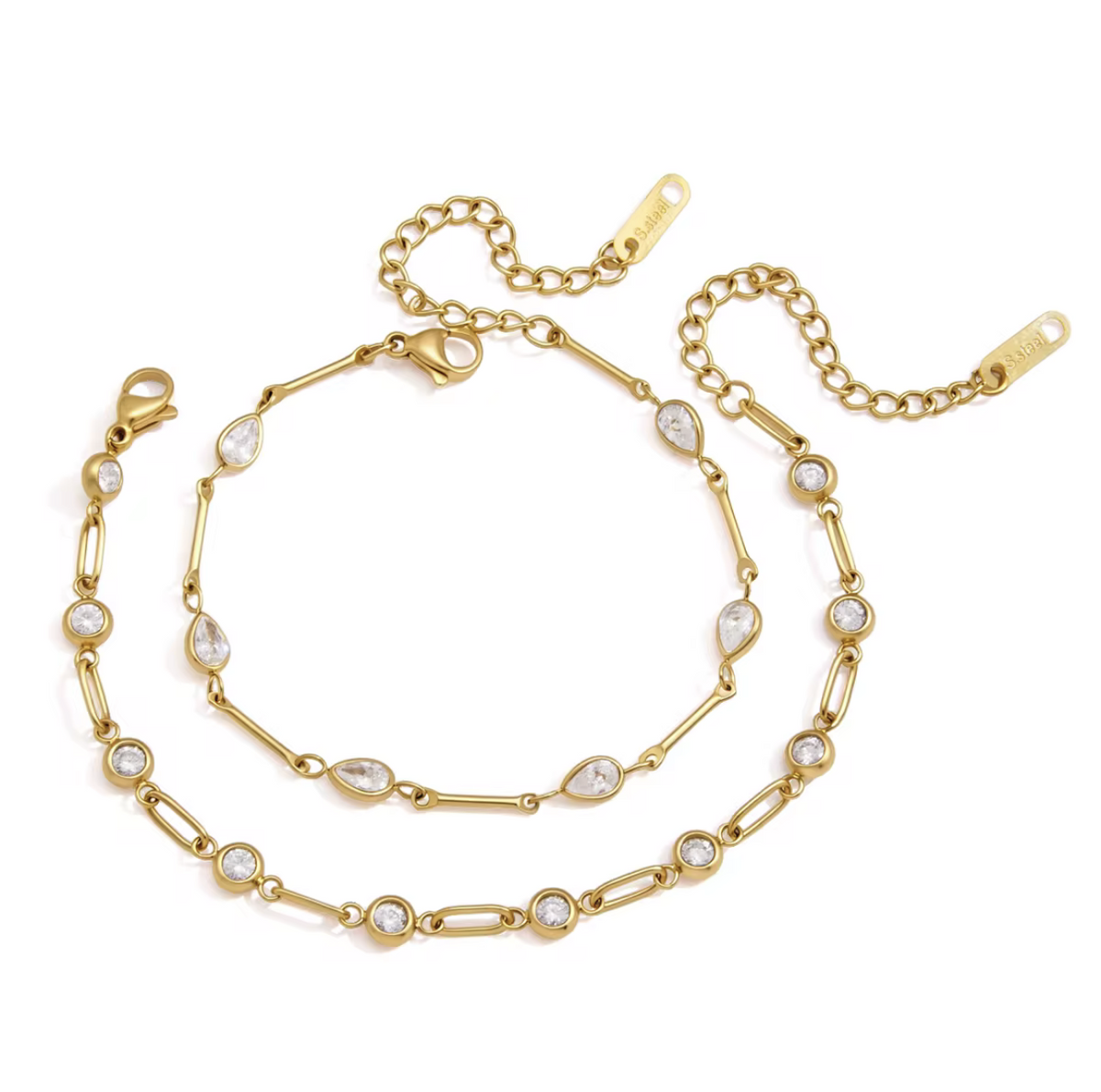 A gold-toned double-strand chain necklace with clear teardrop and round gemstones, displayed on a clean white background.