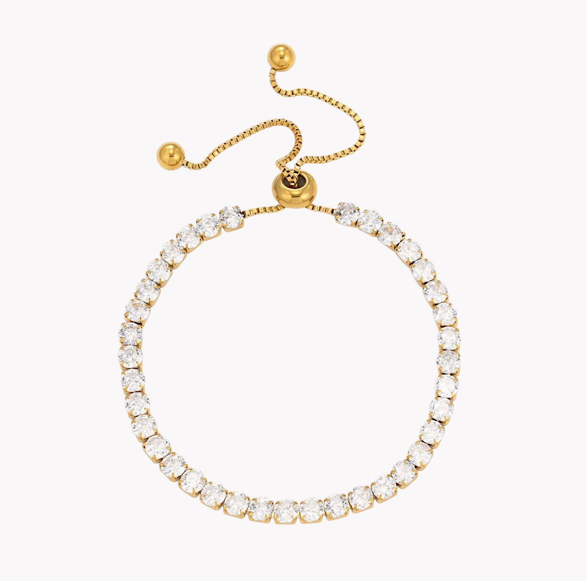 A gold adjustable bracelet featuring a single row of clear round-cut stones, shown on a plain white background.