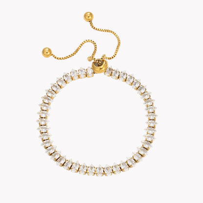 A gold-plated adjustable ring bracelet adorned with clear rectangular crystals, shown on a plain white background.