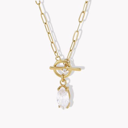 gold necklace with marquise gemstone pendant pictured ona light grey background