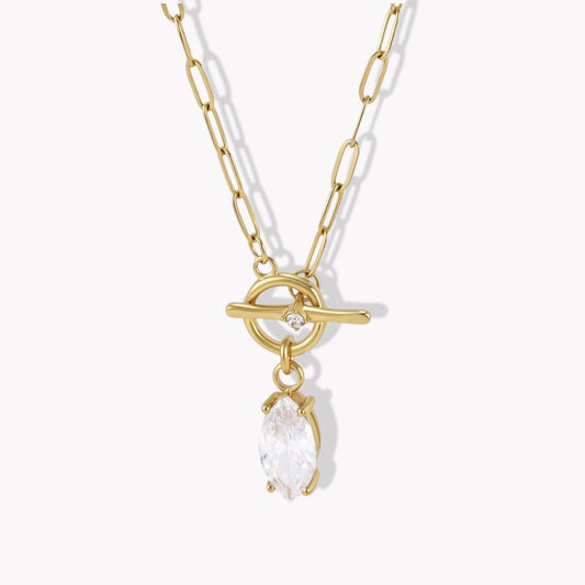 gold necklace with marquise gemstone pendant pictured ona light grey background