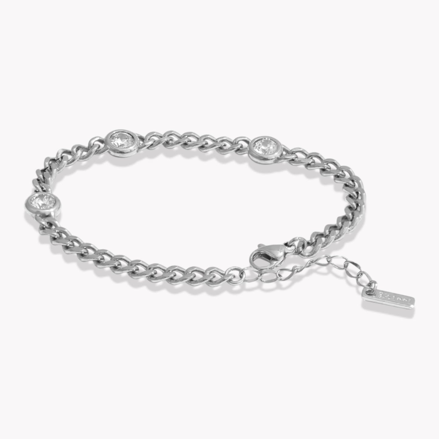 Silver bracelet with 3 small round gemstones on a white background