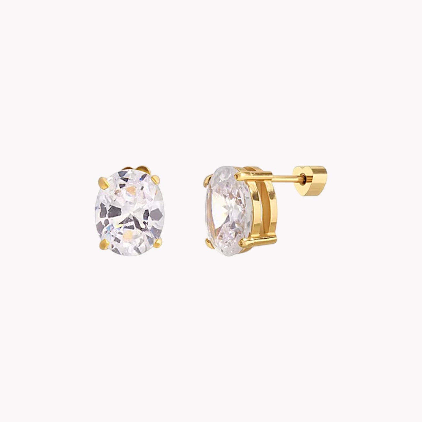 Gold stud earrings with clear gemstones on a white background