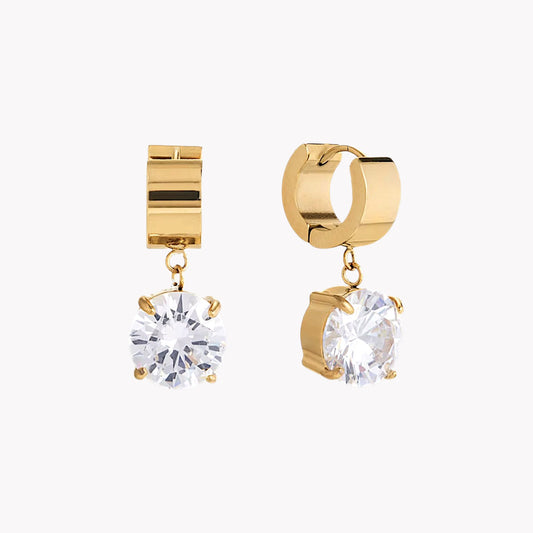 gold hooped earrings with large round gemstone pictured on a light grey background