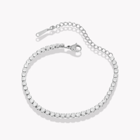 Silver bracelet with clear stones on a white background