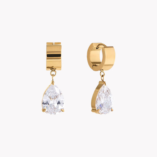 Gold hooped earring with a large pear shaped gemstone pictured on a light grey background