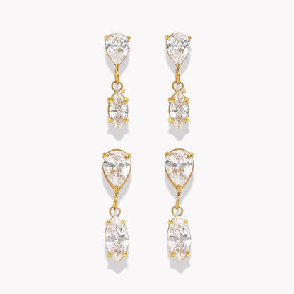 Gold and crystal drop earrings on a white background
