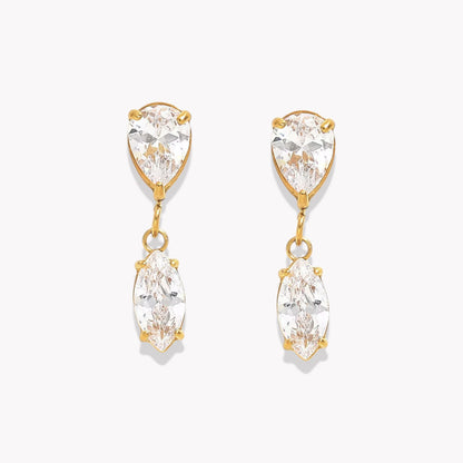 Gold earrings with clear gemstones on a white background