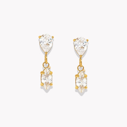 Gold earrings with clear gemstones on a white background