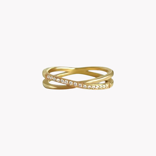 Gold ring with small diamonds and an interlocking design on a white background