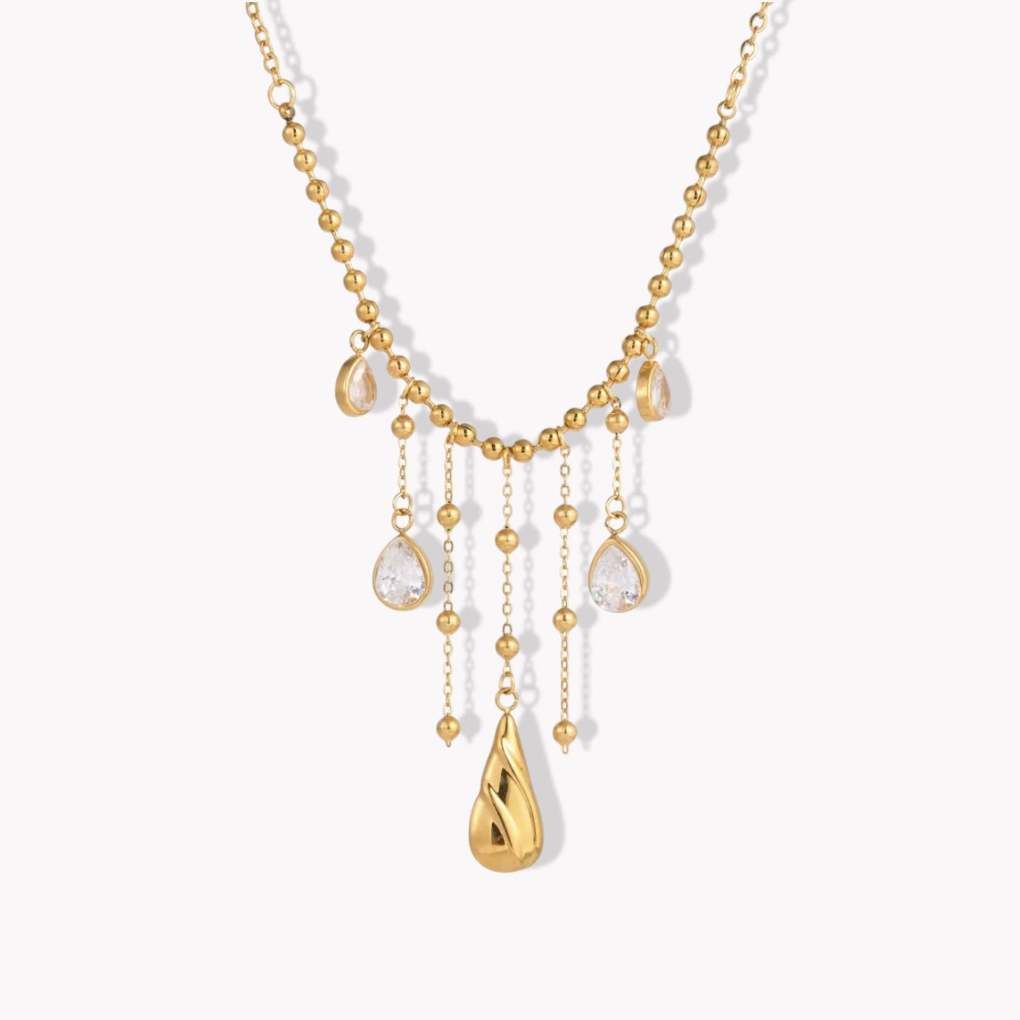 Gold necklace with teardrop-shaped pendants on a white background