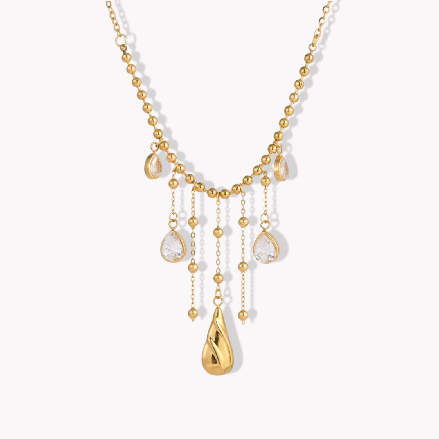 Gold necklace with teardrop-shaped pendants on a white background