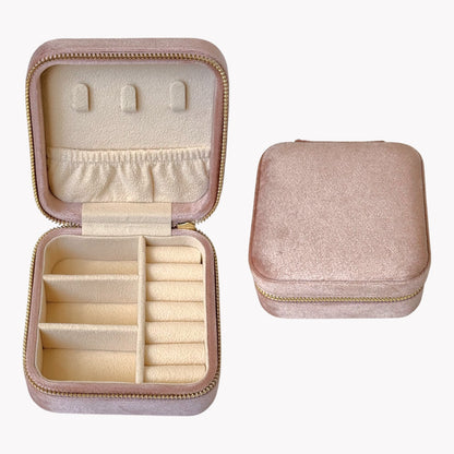 Pink jewelry case with compartments on a white background