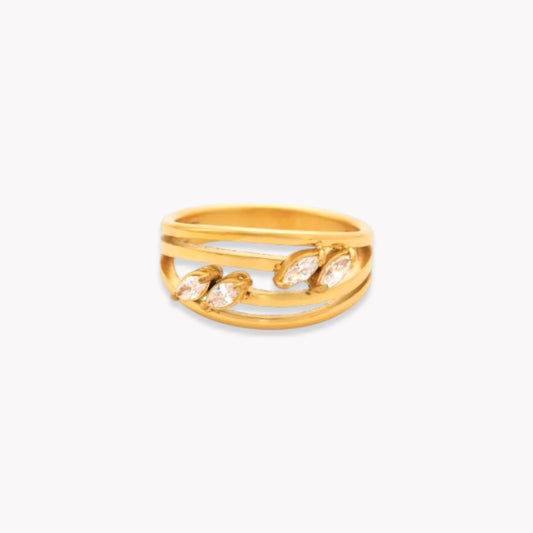 Gold ring with layers of ring band and four marquise shaped stones on a white background