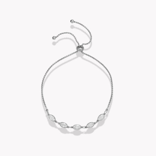 Silver bracelet with five clear oval stones on a white background