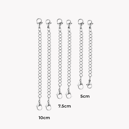 A collection of necklace extenders in silver color with clasps attached to each end.