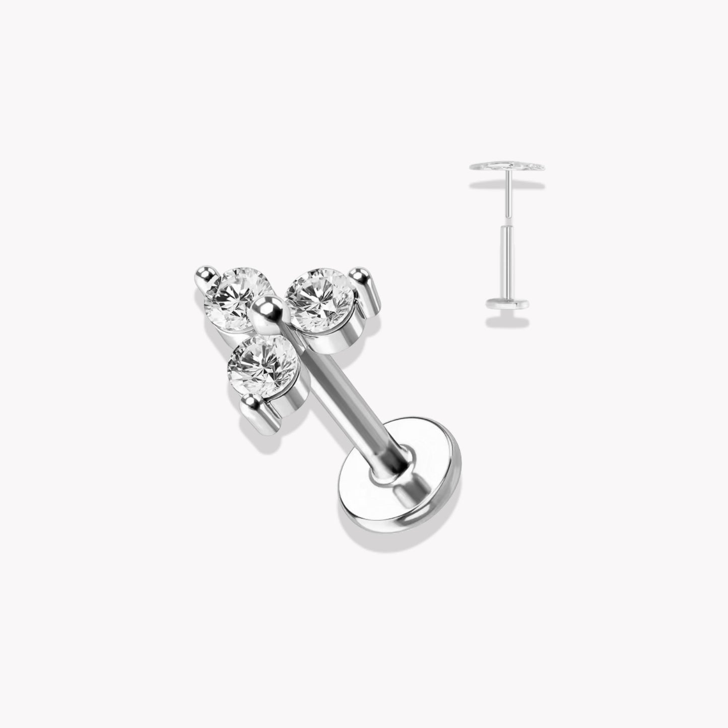 Set of five silver flat back piercing studs with crystal accents on a white background