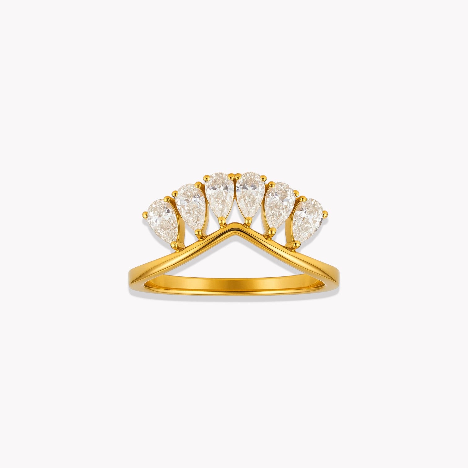 Gold ring with pear-shaped diamonds on a white background