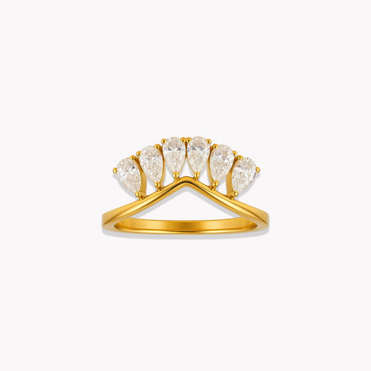Gold ring with pear-shaped diamonds on a white background