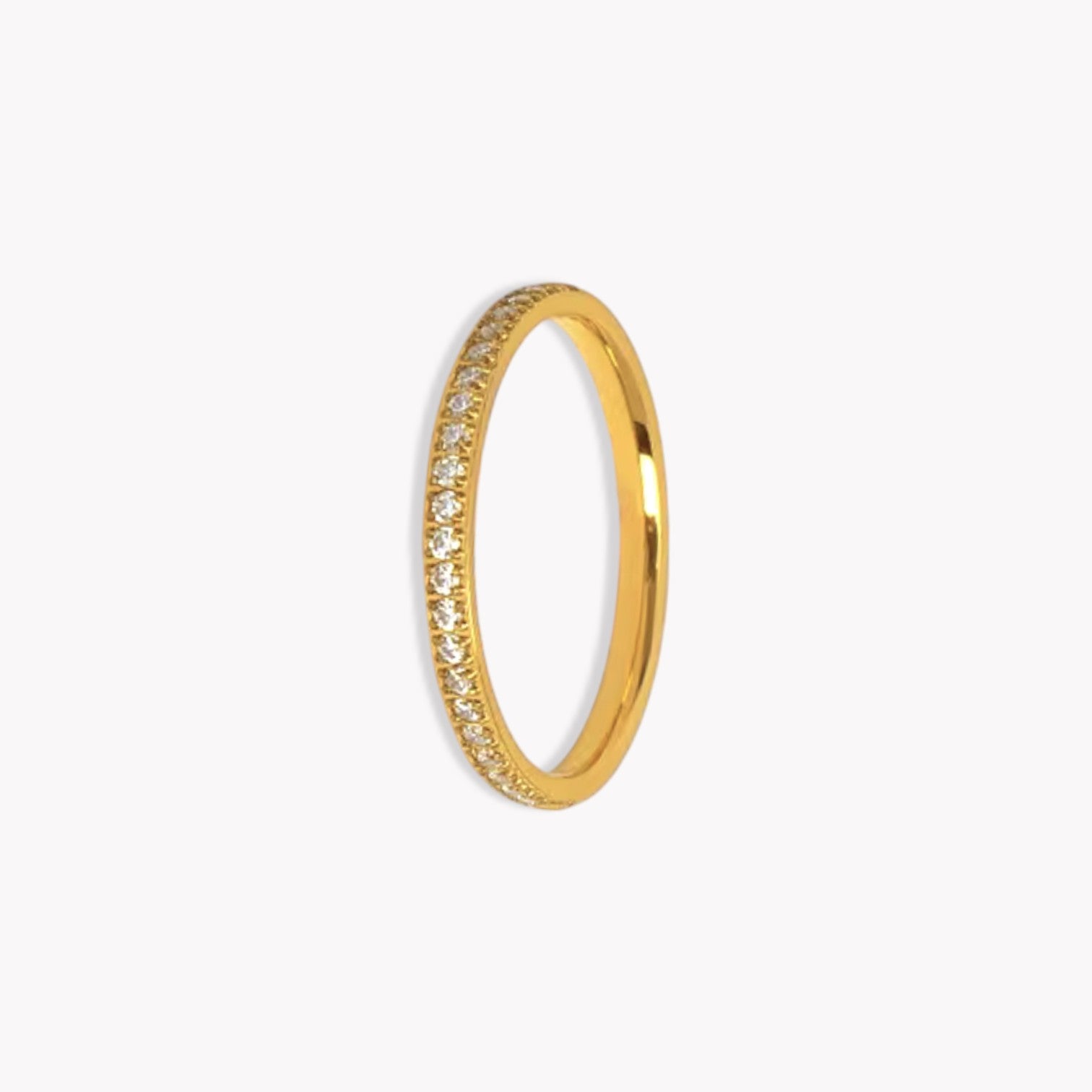 Gold ring with small diamonds on a white background