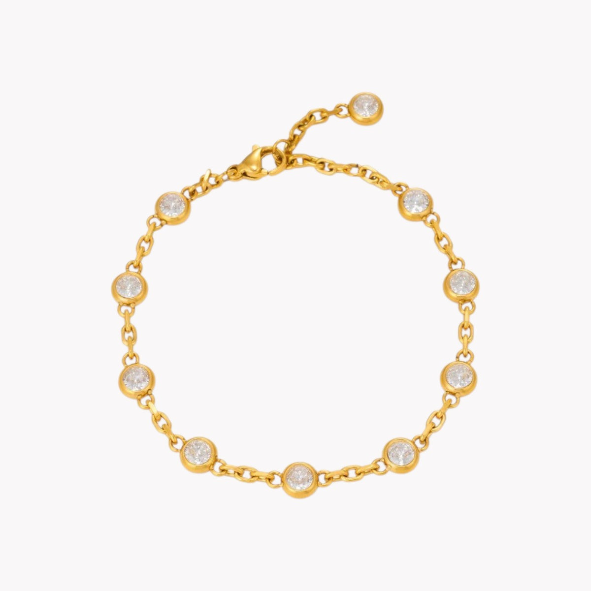 A gold chain bracelet with eight bezel-set clear round stones, displayed on a clean white background.