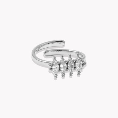 Silver adjustable ring with marquise-shaped gemstones on a white background
