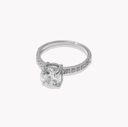 silver ring with gemstones on a light grey background