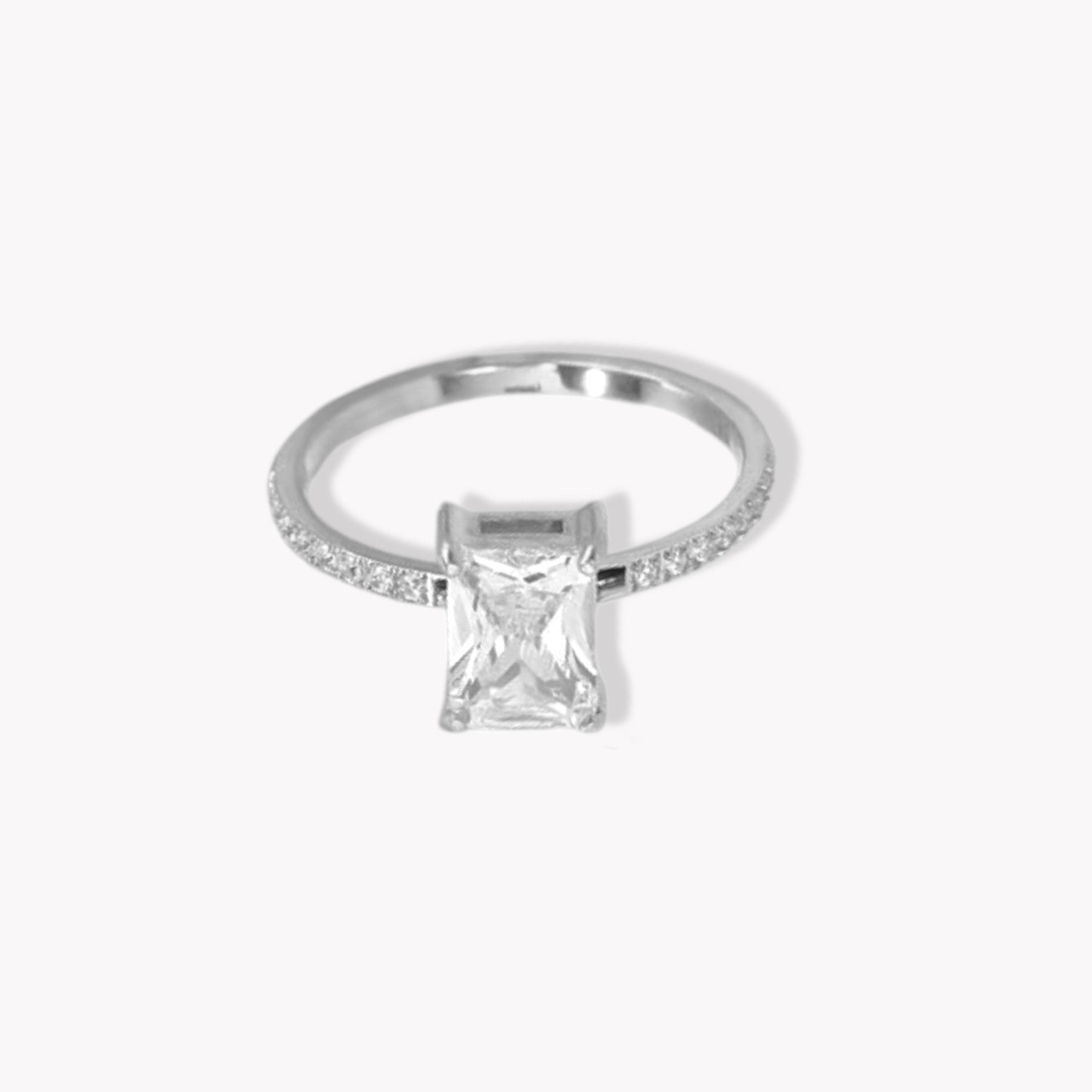 Silver ring with a square-cut diamond on a white background