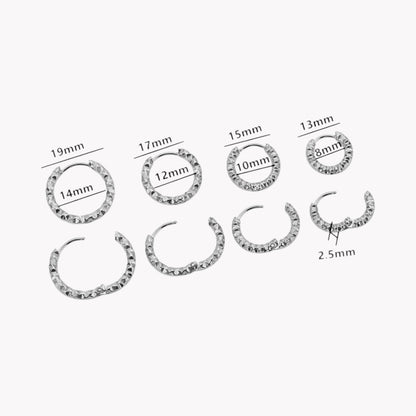 Silver hooped earrings in 4 different sizes shown in both an open and closed position