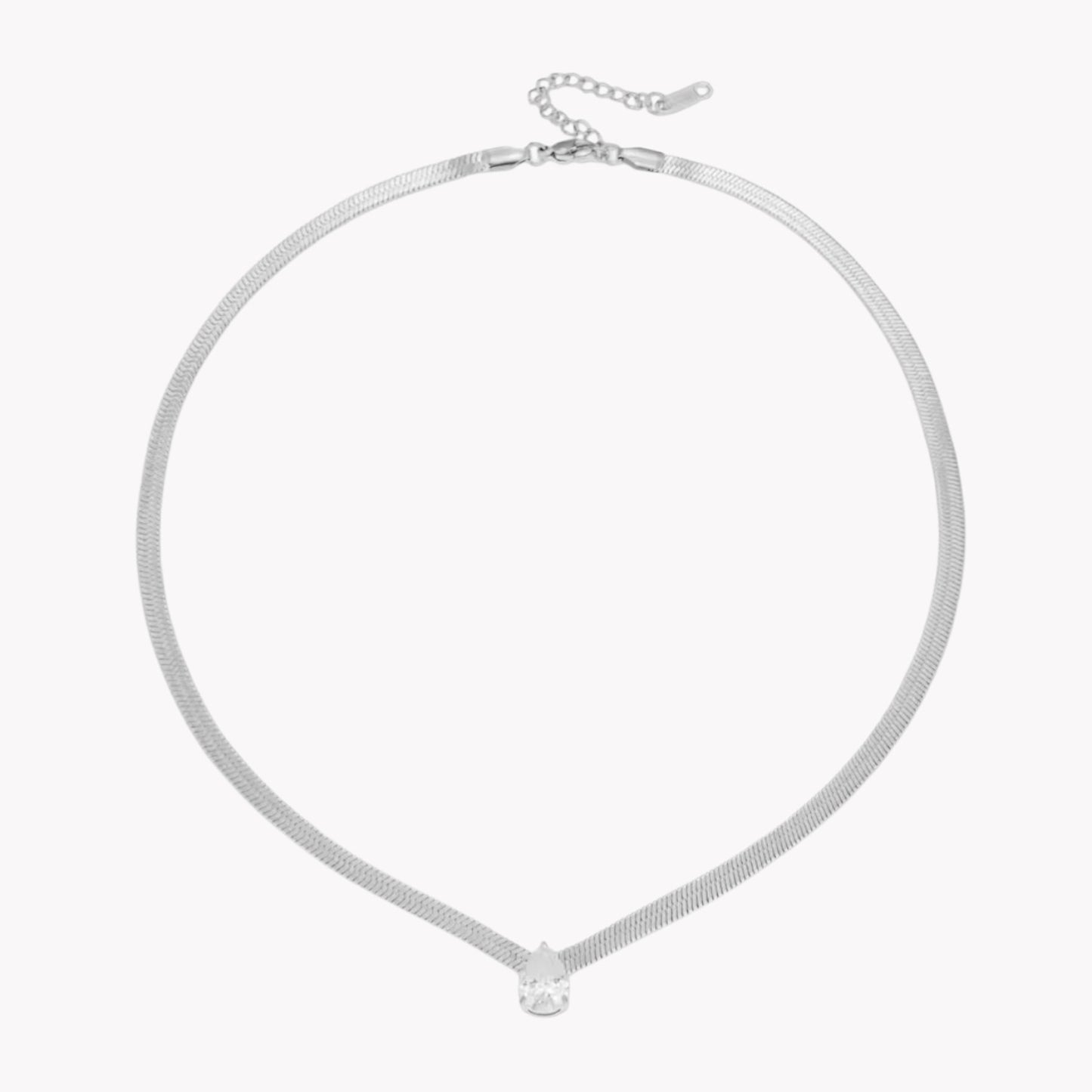 Silver necklace with a small pear pendant on a white background