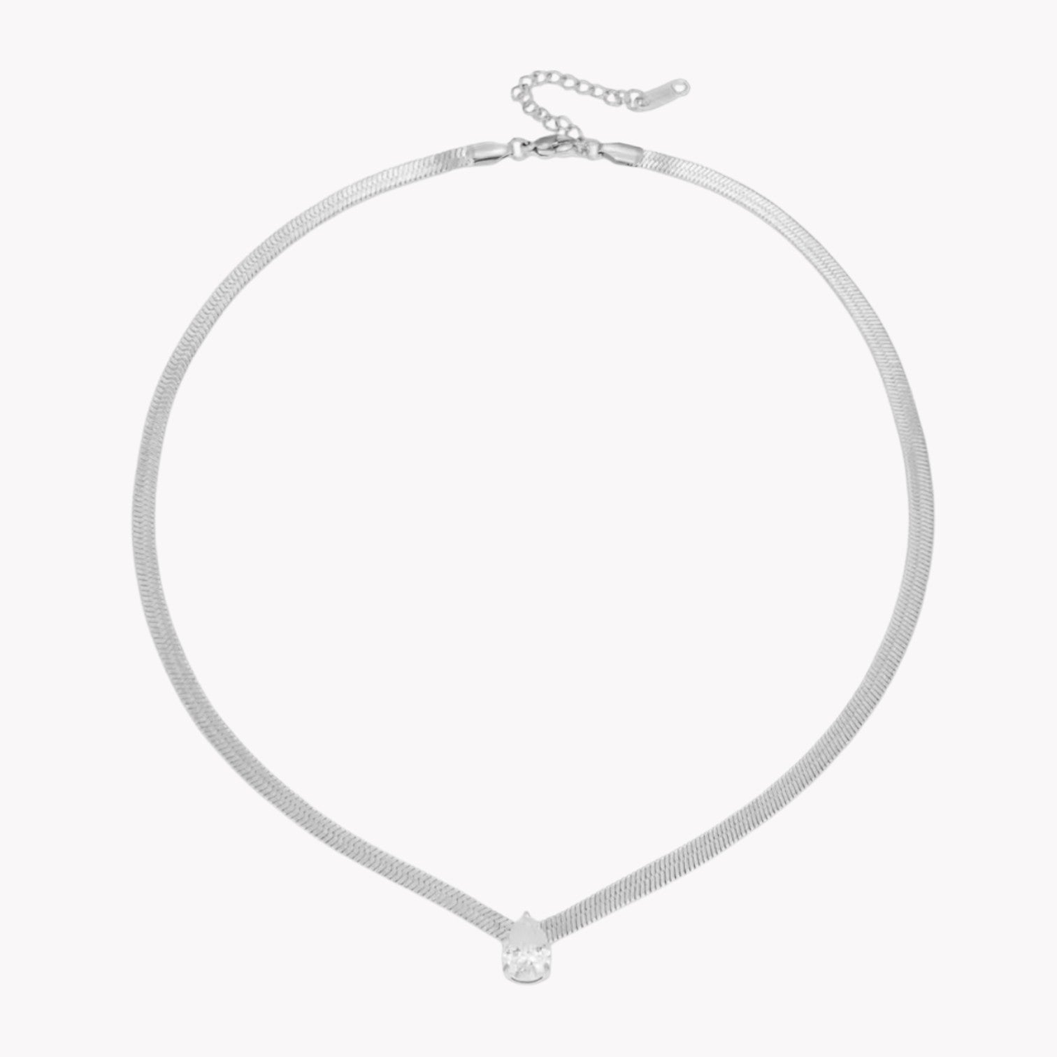 Silver necklace with a small pear pendant on a white background