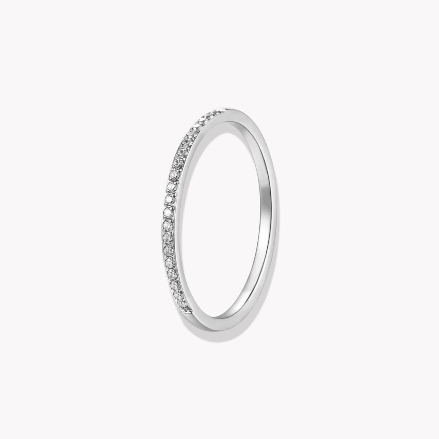 Silver ring with small stones on a white background