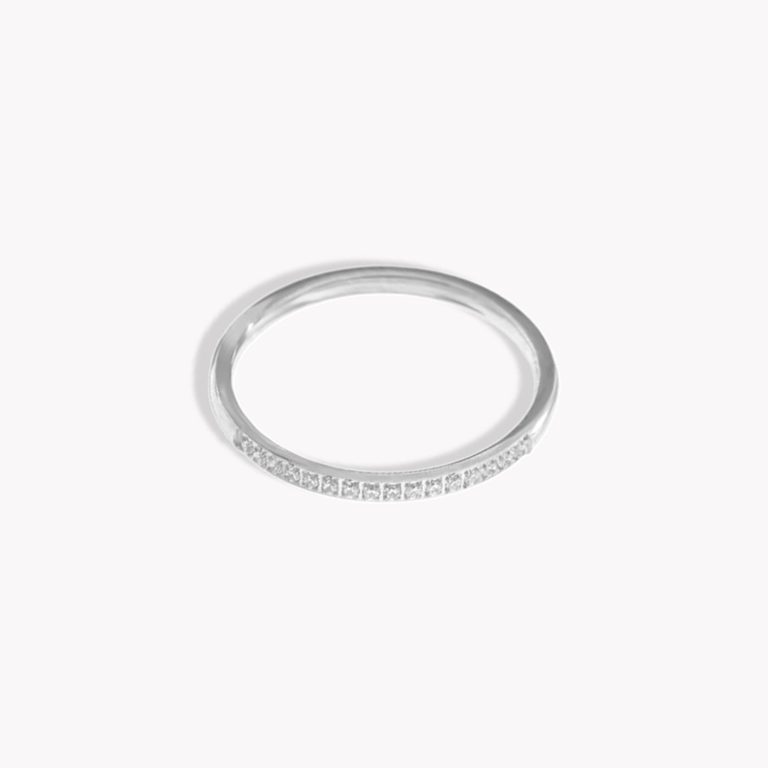 Silver ring with small stones on a white background