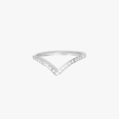 Silver wishbone ring with small clear gemstone detail along the band. Pictured on a white background