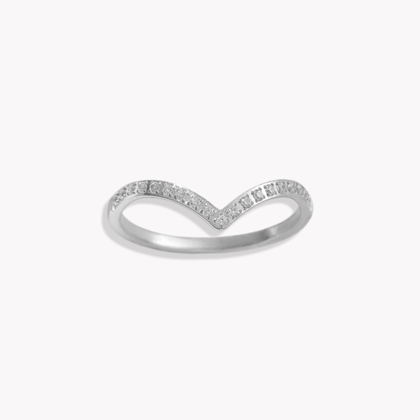Silver wishbone ring with small clear gemstone detail along the band. Pictured on a white background