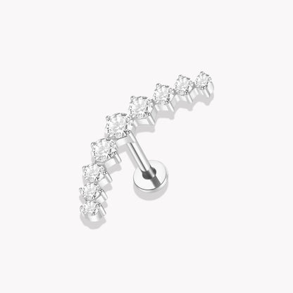 Set of silver earrings with clear gemstones on a white background