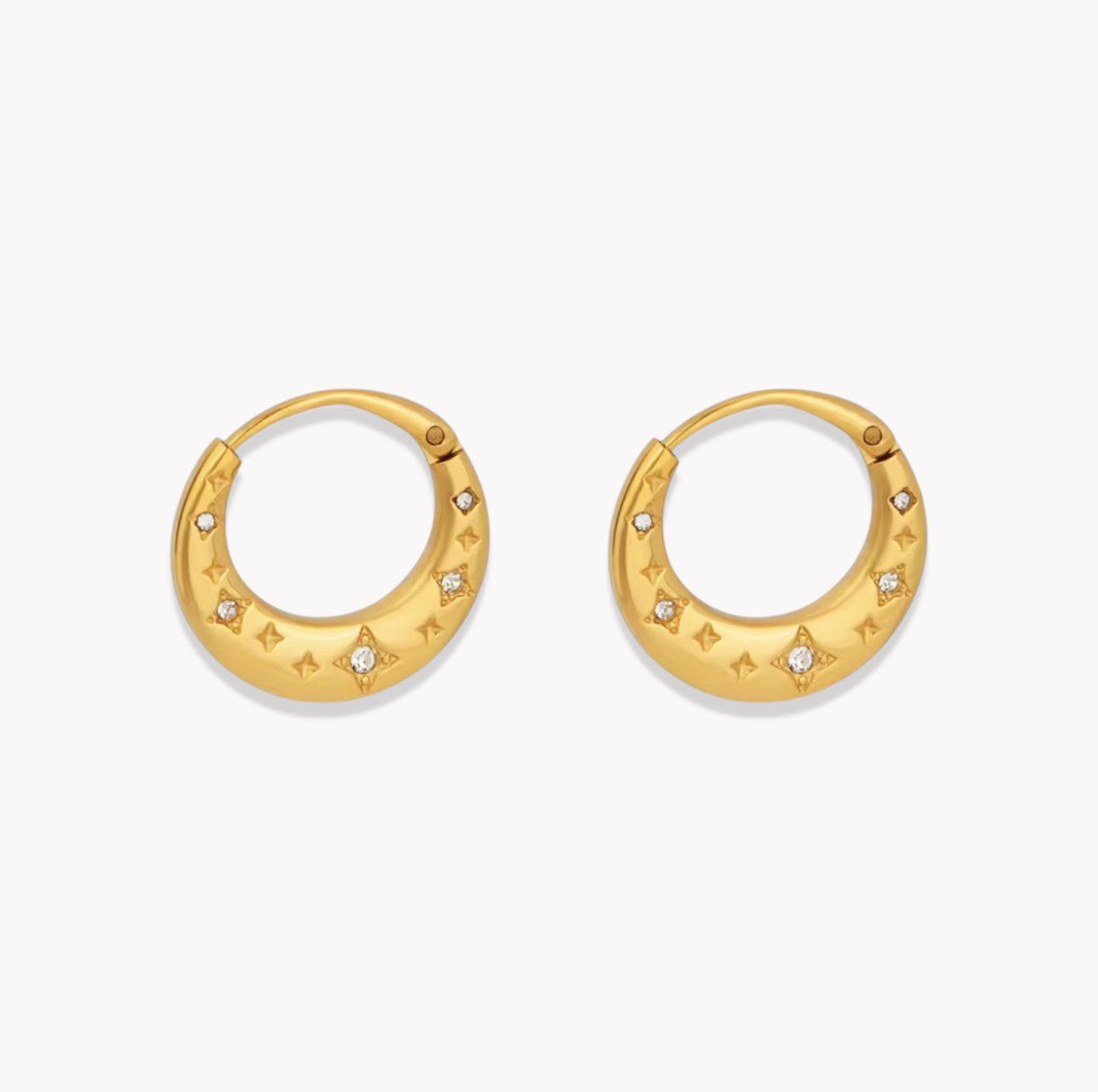 Gold hoop earrings with star designs on a white background