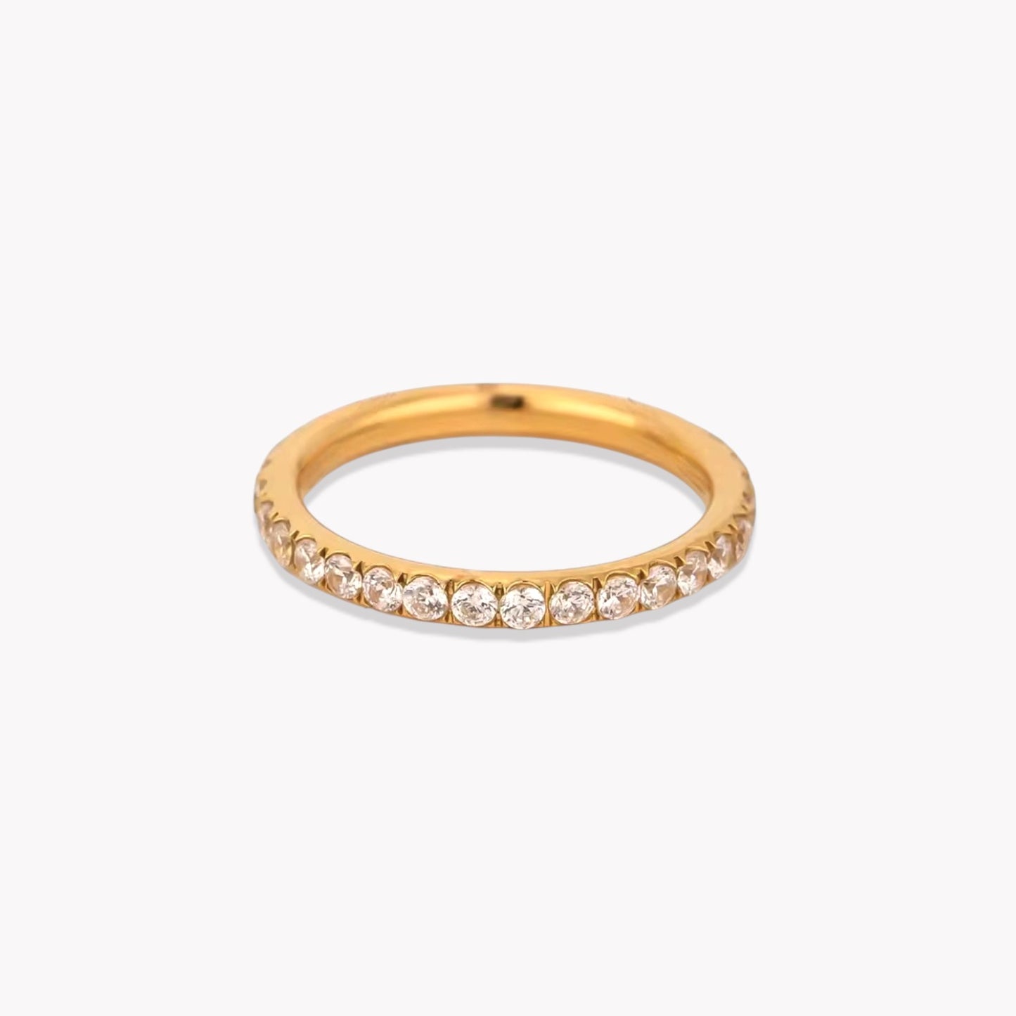 Gold ring with small diamonds on a white background